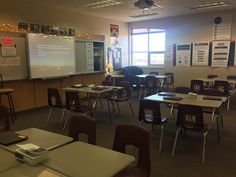 an empty classroom with desks and chairs