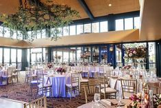 a banquet hall with tables and chairs set up for an event