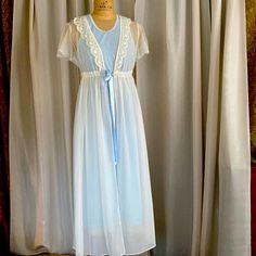 Flora Night Gown 2 Pieces Beautiful Very Delicate Look Never Used Just Hanging In The Closet For Years Still Have The Original Flora Hunger. Ivory And Baby Blue Color From Smoking Free Home. Blue Gown About 47” Long Robe About 53 “ Long Sheer Cream Nightgown For Sleep, Cream Sheer Nightgown For Sleep, Blue Sheer Sleepwear For Wedding Night, Sheer Blue Sleepwear For Wedding Night, Sheer Cream Sleepwear For Wedding Night, Feminine Blue Sleepwear For Night, Feminine Blue Sleepwear, Blue Nightgown, Nordstrom Women