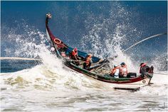 a group of people riding on top of a boat in the ocean