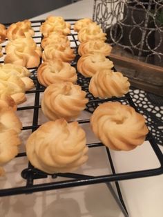 there are many small pastries on the cooling rack