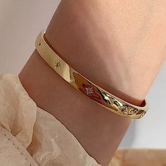 Gold plated starburst North Star bangle cuff bracelet. THIS LISTING GOLD Star Bangle Bracelet, Gold Cuff Bracelet Women, Gold Cuffs Bracelet, Bracelet Designs Gold For Women, Gold Bangle Design, Gold Bangle Bracelet For Women, Stylish Gold Earrings, Gold Jwellary, Dubai Gold Bangles