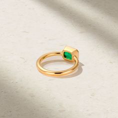 This ageless design inspired by the Art Deco era showcases an alluring emerald that rests within a smooth and delicate bezel frame. Twinkling diamonds cascade downwards along the shank, adding a touch of sparkle that shimmers with each movement. We love this classic yet modern style worn solo for a lasting impact. Metal: 18kt Gold Emerald Weight: 1.45 ct. Diamond Weight: 0.08 ct. Measurements: 7.0 mm length *Please note that the listed ct. weights are approximate and may be subject to slight var Timeless Emerald Ring With Bezel Setting For May Birthstone, Timeless Bezel-set Emerald Ring For May Birthstone, Timeless Bezel Set Emerald Ring For May Birthstone, Timeless May Birthstone Emerald Ring With Bezel Setting, Elegant Bezel-set Emerald Ring For May Birthstone, Elegant Asscher Cut Emerald Ring With Bezel Setting, Timeless Emerald Ring With Single Diamond For Gift, Elegant Emerald Ring With Smooth Bezel For Anniversary, Timeless Emerald Ring With Single Diamond As Gift