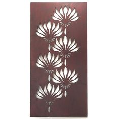 a brown and white wall hanging with flowers on it