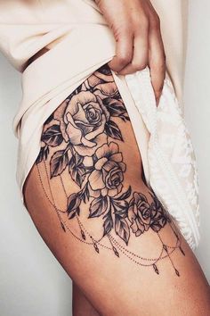 a woman's thigh with flowers on it