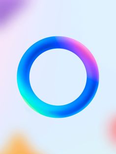 a circular object is shown in the middle of blurry colors and shapes that appear to be floating