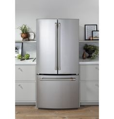 a large stainless steel refrigerator in a kitchen