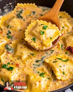 a wooden spoon is in a skillet filled with ravioli and cheese, garnished with parsley