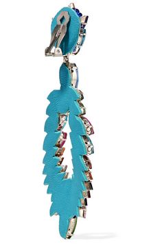 a blue seahorse is hanging from a hook on a white background with clippings