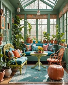 a living room filled with furniture and lots of plants