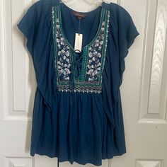 Anthropologie Ranna Gill Blouse New With Tags Beautiful Embroidered In Front . Blue , Turquoise And White Chest Is 21 In Length Is 26 In Size Large Smoke Free Home Fast Shipper Casual Blue Embroidered V-neck Top, Embroidered V-neck Top For Day Out, Blue V-neck Top With Floral Embroidery, Blue V-neck Peasant Top For Summer, Spring Beach Embroidered Blue Top, Spring Blue Embroidered Top For Beach, Blue Casual Embroidered V-neck Top, Blue Embroidered Short Sleeve Top For Vacation, Blue Floral Embroidery Top For Vacation