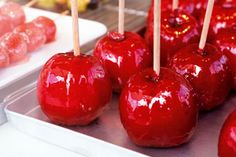 several red apples with toothpicks sticking out of them