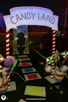 candy land entrance at night with decorations