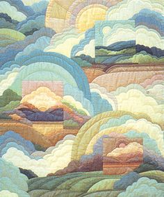 a quilted wall hanging with clouds and mountains in the sky on top of it