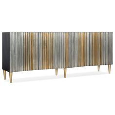 the sideboard is made out of metal strips and has gold, black, and white stripes