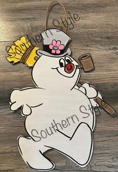 a wooden sign that says southern style with a snowman on it's head