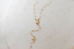 Rosary style necklace Elegant Adjustable Cross Necklace, Elegant Adjustable Gold Cross Necklace, Elegant Cross Pendant Lariat Necklace With Adjustable Chain, Dainty Adjustable Cross Necklace, Elegant Cross Lariat Necklace With Adjustable Chain, Adjustable Length Cross Jewelry For Gift, Elegant Gold Cross Lariat Necklace, Elegant Cross-shaped Lariat Necklace With Adjustable Chain, Elegant Gold Lariat Necklace With Cross