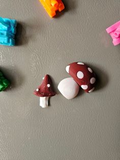 several different types of plastic toys on a table with water droplets and toothbrushes