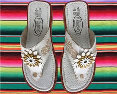 Traditional Women's hand crafted Mexican sandals.Light weight and comfortable with unique floral design. Traditional White Closed Toe Sandals, Traditional White Round Toe Sandals, Traditional White Huarache Sandals For Summer, Traditional White Huarache Sandals For Spring, Traditional White Huaraches For Beach, White Slip-on Huarache Sandals For Spring, Traditional White Closed Toe Huarache Sandals, Traditional White Huarache Sandals With Round Toe, White Leather Huarache Sandals For Spring