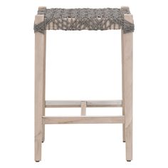 a stool made out of wood and wicker with an upholstered seat cushion