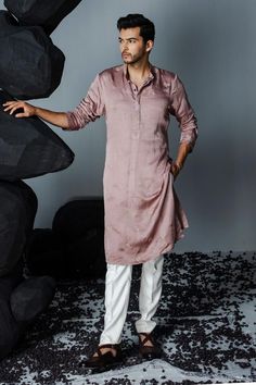 Mauve linen silk kurta with crystal embroidered leaf patterns. Comes with pant.
Components: 2
Pattern: Embroidered
Type Of Work: Crystal
Neckline: Mandarin Collar
Sleeve Type: Full
Fabric: Linen silk
Color: Purple
Other Details: 
Straight silhouette
Weight: 800 kgs
Occasion: Mehendi and Puja - Aza Fashions Ivory Pants, Silk Kurta Set, Kurta Pants, Motif Embroidery, Gents Kurta, Modern Mens Fashion, Indian Men Fashion, Pants Linen, Embroidered Leaves