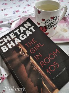 the girl in the room 005 by cheetah bhagatt is next to a cup of tea