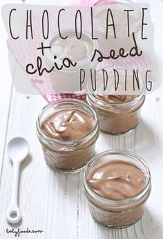 three jars filled with chocolate chia seed pudding on top of a white wooden table