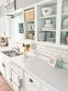 the kitchen is clean and ready to be used for cooking or baking, as well as dishes