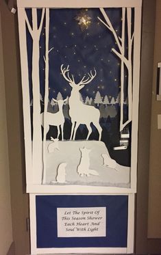 a paper cut out of a deer and two dogs in the woods at night with stars