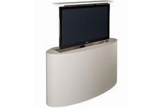 a flat screen tv mounted to the side of a white curved wall shelf with a television on top