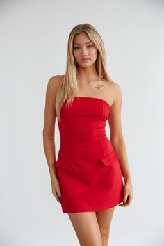 Feel fun and flirty in the Penelope Strapless Front Pocket Mini Dress! Available in red and black, this mini dress features a straight across strapless neckline, a fit and flare silhouette, double front faux pockets. Pair with some cute heels for the perfect date night look! Details 5% Rayon, 30% Nylon, 5% Spandex Material has stretch Hand wash cold, line dry Cheap Chic Mini Dress With Pockets, Chic Cheap Mini Dress With Pockets, The Perfect Date, Perfect Date Night, American Threads, Red Homecoming Dresses, Ruffle Mini Skirt, Strapless Neckline, Cute Heels