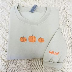 Celebrate the spirit of the season with our Embroidered Pumpkin Sweatshirt and Halloween Sweatshirt. Embrace the cozy charm of fall and the enchantment of spooky moments. Whether it's for yourself or a loved one, our Embroidered Crewneck is the perfect gift for those who cherish warmth and love. 🎈 Product Details - T- Shirt: 5.3 oz., 100% preshrunk cotton - Sweatshirt : 8 oz., 50% USA cotton, 50% polyester - Hoodie: 8 oz., 50% USA cotton, 50% polyester 🎈 Sizing and Coloring - Our top-selling s Pumpkin Embroidery Shirts, Fall Sweatshirt With Embroidered Graphics, Fall Crew Neck Sweatshirt With Custom Embroidery, Fall Cotton Sweatshirt With Embroidered Graphics, Fall Long Sleeve Sweatshirt With Custom Embroidery, Fall Embroidered Graphics Sweatshirt With Relaxed Fit, Fall Embroidered Graphics Sweatshirt In Relaxed Fit, Cotton Sweatshirt With Embroidered Graphics For Fall, Embroidered Long Sleeve Sweatshirt For Fall