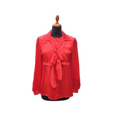 A delightful Woman's button up blouse in finest silk satin. This blouse is fastened with six matching fabric hand covered buttons on the front. This blouse has a semi over blouse which is fastened with a single button and a tie under the breast line. The collar is a classic open shirt style.  Length = 63 cm Breast line width = 100 cm Hip = 104 cm Waist = 104 cm Arm length = 61 cm Size: De 36/38 / UK 10/12 / F 38/40 / I 42/44 / US 6/8 / RUS 44/46  "P" Dry clean only Red Silk Blouse, Blouse With Collar, Winter Blouses, National Dress, Red Blouse, Elegant Blouses, Satin Silk, Red Satin, Red Shirt