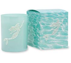 a candle with a starfish design on it