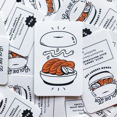 several business cards with food illustrations on them