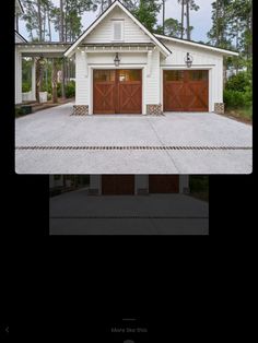 two garages in front of a white house with brown doors and windows on each side