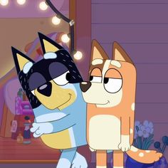 two cartoon characters hugging each other in front of a mirror with lights on the wall behind them