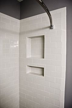 a white shower with no curtain in a bathroom