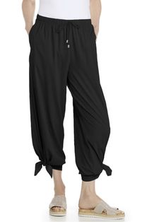 Lightweight Petra wide leg pants from Coolibar. These wide legs sit just below the waist and feature floor-grazing hems with convertible, mid-calf ties for a fun harem pant look. Easy to care for machine wash fabric with UPF 50+ sun protection you can depend on. UPF 50+ Straight leg with wide leg opening Side seam vent to mid-calf ability to tie Side seam pockets Self drawcord with hardware ends Aire™ fabric: Luxurious, silky fabric with beautiful drape, feather-light and breathable with built-i Sun Protective Clothing, Hooded Tunic, Harem Pant, Best Swimsuits, Golf Skirts, Protective Clothing, Wide Leg Pant, Swimsuit Cover Ups, Women Pants Casual