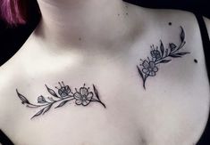 a woman's chest with flowers and leaves tattoo on her left side ribcage