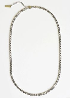 This stainless steel curb chain necklace is a sleek and durable accessory, perfect for any man's wardrobe. The versatile design and high-quality material make it a long-lasting addition to any outfit. With its classic style and masculine aesthetic, this necklace is sure to elevate any look. 100% steel 22" length + 2" extension 5mm width Silver Curb Chain Necklace, Masculine Aesthetic, Curb Chain Necklace, Cool Clothing, Neck Chain, Men's Wardrobe, Curb Chain, Silver Chain, Classic Style