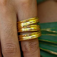 The Terra Wrap Ring winds gracefully around your finger, mirroring the contours of the earth itself. Inspired by earth's organic textures, the intricate wrap design symbolizes the interwoven roots of life, reminding you of the profound connection we share with the land. 18K Gold-Plated Stainless Steel Nickel-Free Lead-Free Hypoallergenic Water Resistant Gold Hand Wrapped Spiritual Rings, Hand Wrapped Gold Spiritual Rings, Spiritual Hand Wrapped Gold Rings, Gold Hand Wrapped Nature-inspired Jewelry, Gold Adjustable Nature-inspired Rings, Gold Wrap Ring, Organic Textures, Wrap Ring, Wrap Rings