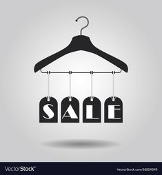 clothes hangers with sale tags on gray background