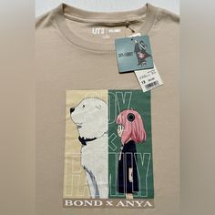 This Uniqlo T-Shirt Featuring Characters Anya And Bond From The Anime Spy X Family Is A Must-Have For Kids Who Love The Series. Made From 100% Cotton, This T-Shirt Is Perfect For Casual Wear During Summer Or Spring Seasons. The Shirt Has Short Sleeves And A Crew Neck With A Pullover Closure. The Solid Beige Color And Basic Style Make It Versatile For Any Outfit While The Size 13 Fits Kids Aged 12-14. It Is Machine Washable For Easy Care, And The Printed Graphic Design Is Sure To Please Any Spy X Anya T-shirt, Anya And Bond, Family Graphic, Kids Characters, Anime Spy X Family, Uniqlo Shirt, Solid Beige, Spy Family, Kid Character