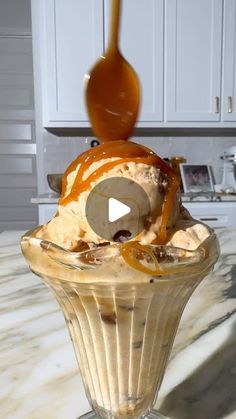 an ice cream sundae with caramel drizzle on top