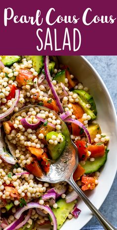 a bowl filled with couscous and vegetables on top of a blue table cloth