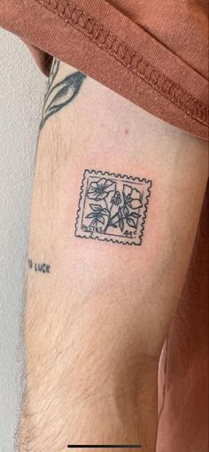 a man's thigh with a stamp on it and the word love written in black ink