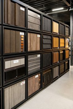 a room filled with lots of different types of flooring samples on display in rows