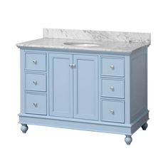 a blue bathroom vanity with marble top and drawers on casteors, against a white background