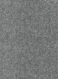 a gray carpet with small white dots on it